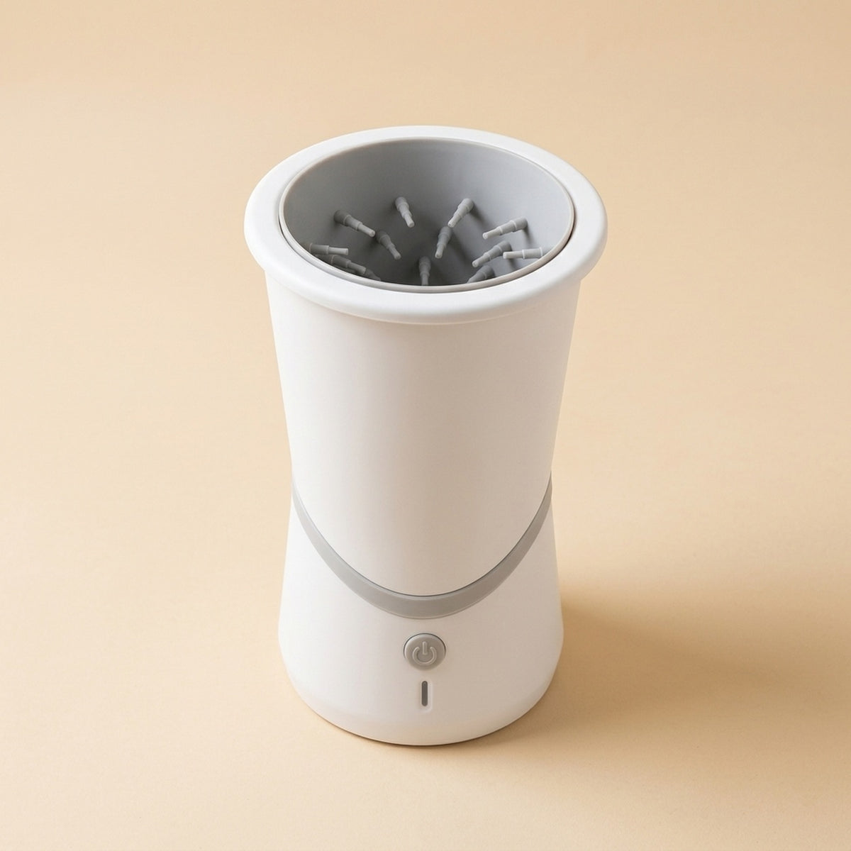 Rechargeable Paw Washer, a white cup with soft gray silicone bristles inside and a power button