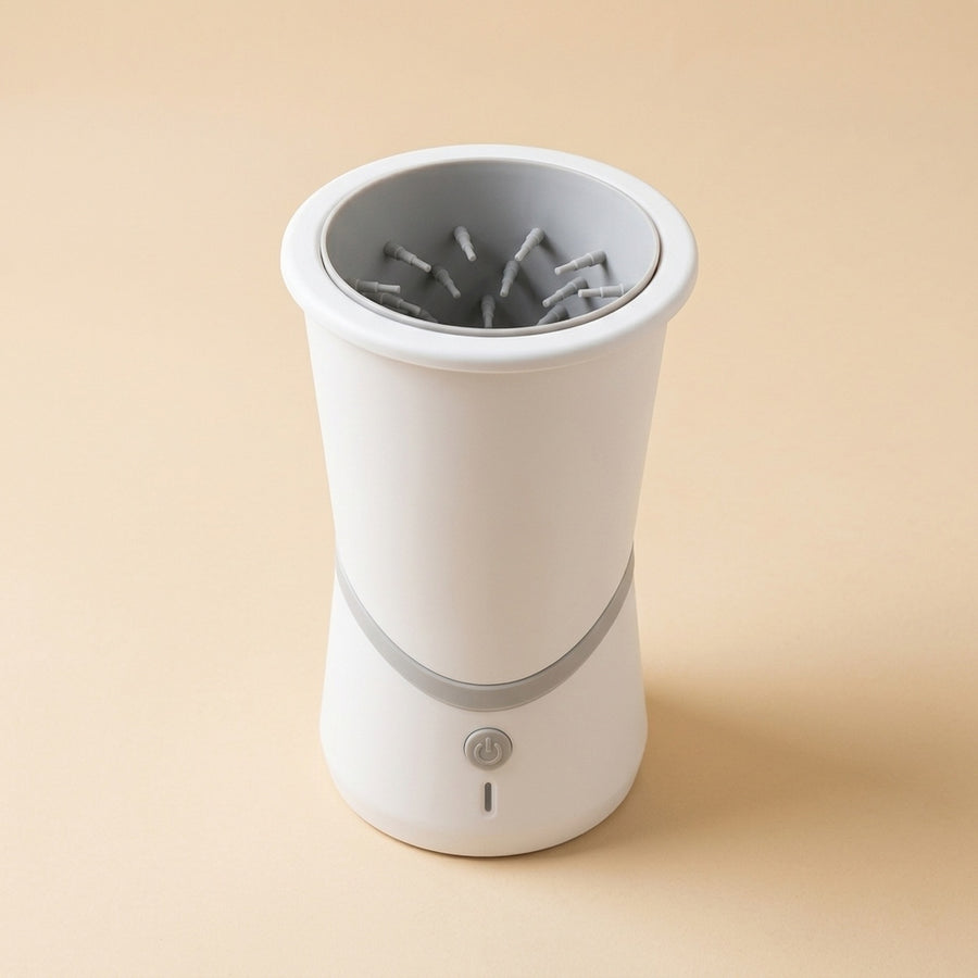Rechargeable Paw Washer, a white cup with soft gray silicone bristles inside and a power button
